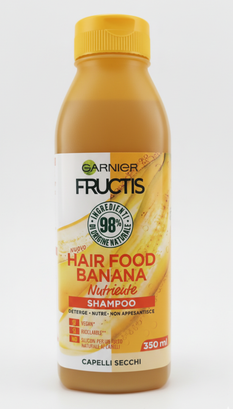 Garnier Fructis Hair Food Shampoo Banana Nutriente 350 ml, shampoo per capelli secchi, formula vegana con 98% ingredienti di origine naturale e senza siliconi, arricchito con estratto di banana e olio di cocco per nutrire, detergere delicatamente e rendere i capelli più morbidi, setosi e facili da gestire.