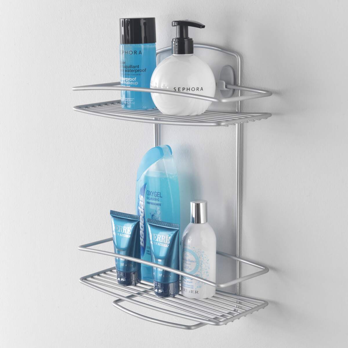 Mensola doccia Metaltex Onda Line a 2 piani in filo d'acciaio con rivestimento Polytherm, porta shampoo e spugne.