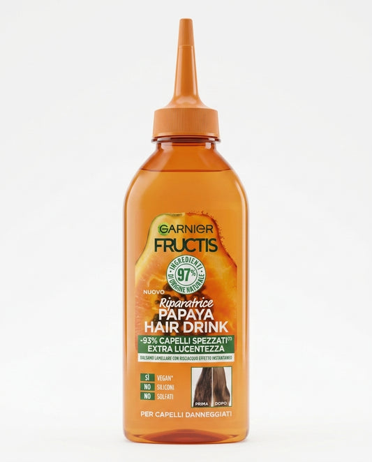 Garnier Fructis Hair Drink Papaya 200 ml, balsamo lamellare riparatore in soluzione liquida con tecnologia istantanea anti-rottura, ideale per capelli danneggiati e spenti.